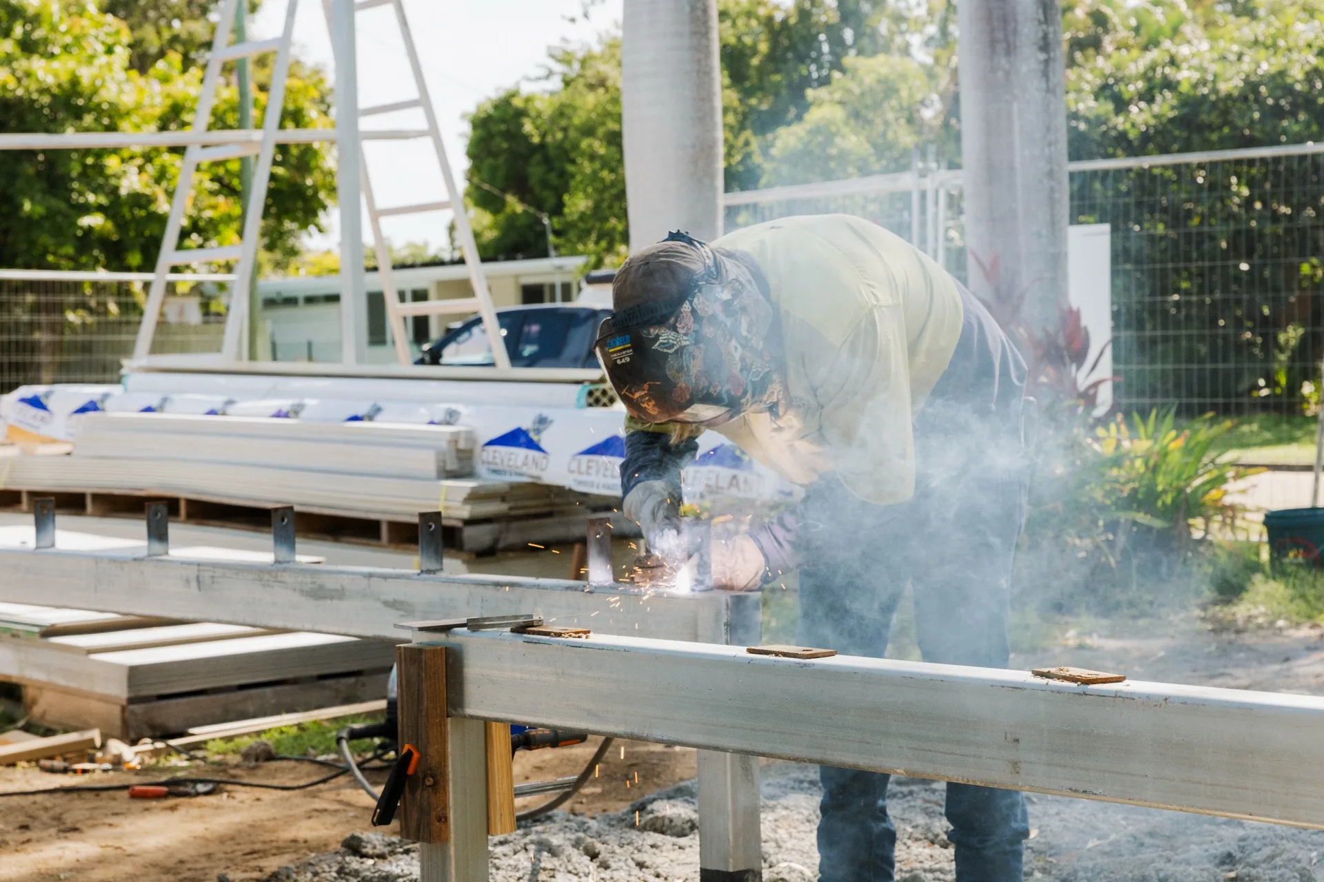 Legacy home extension — welding steel frame on site