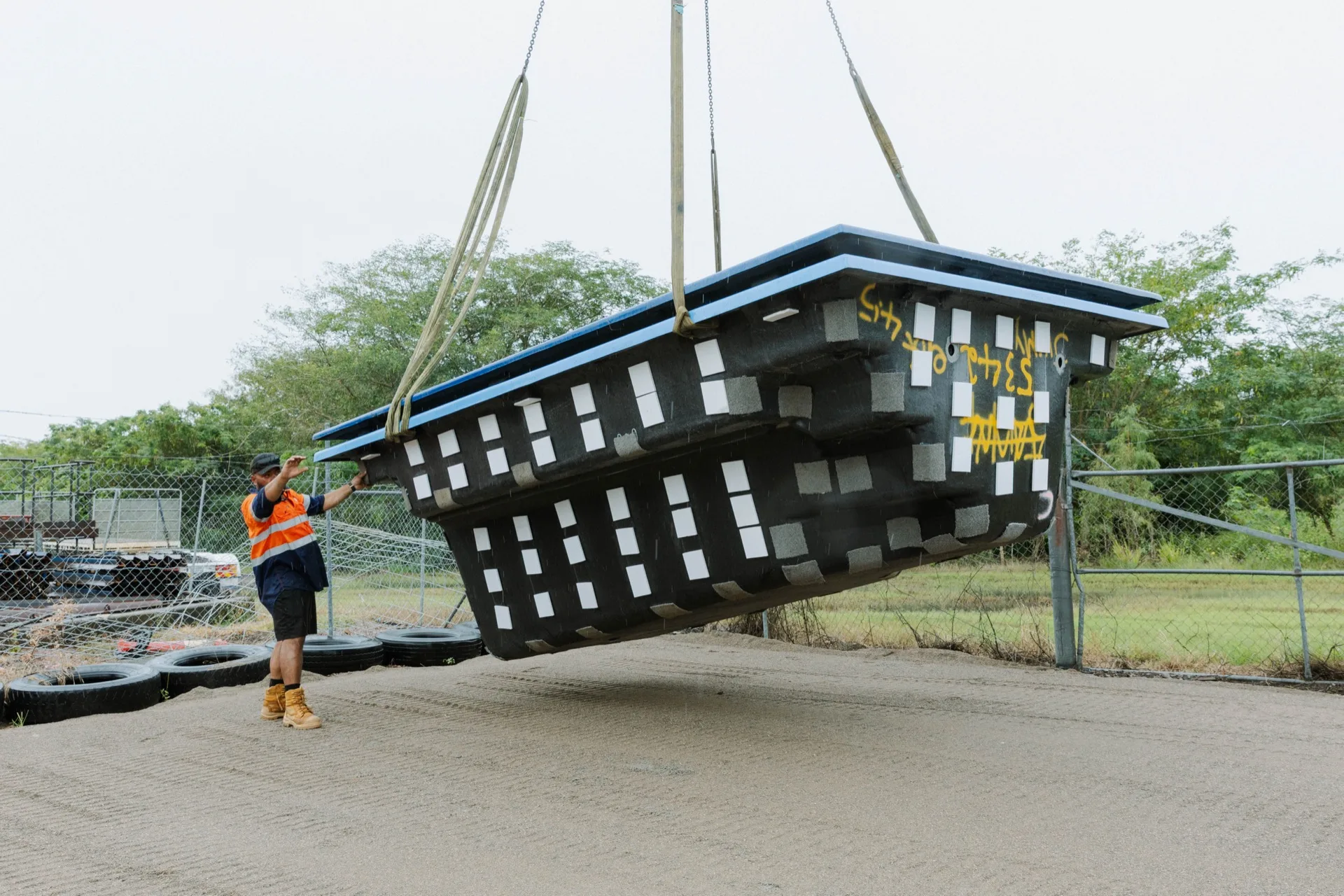 Legacy Building & Construction pool shell being craned into position — Townsville